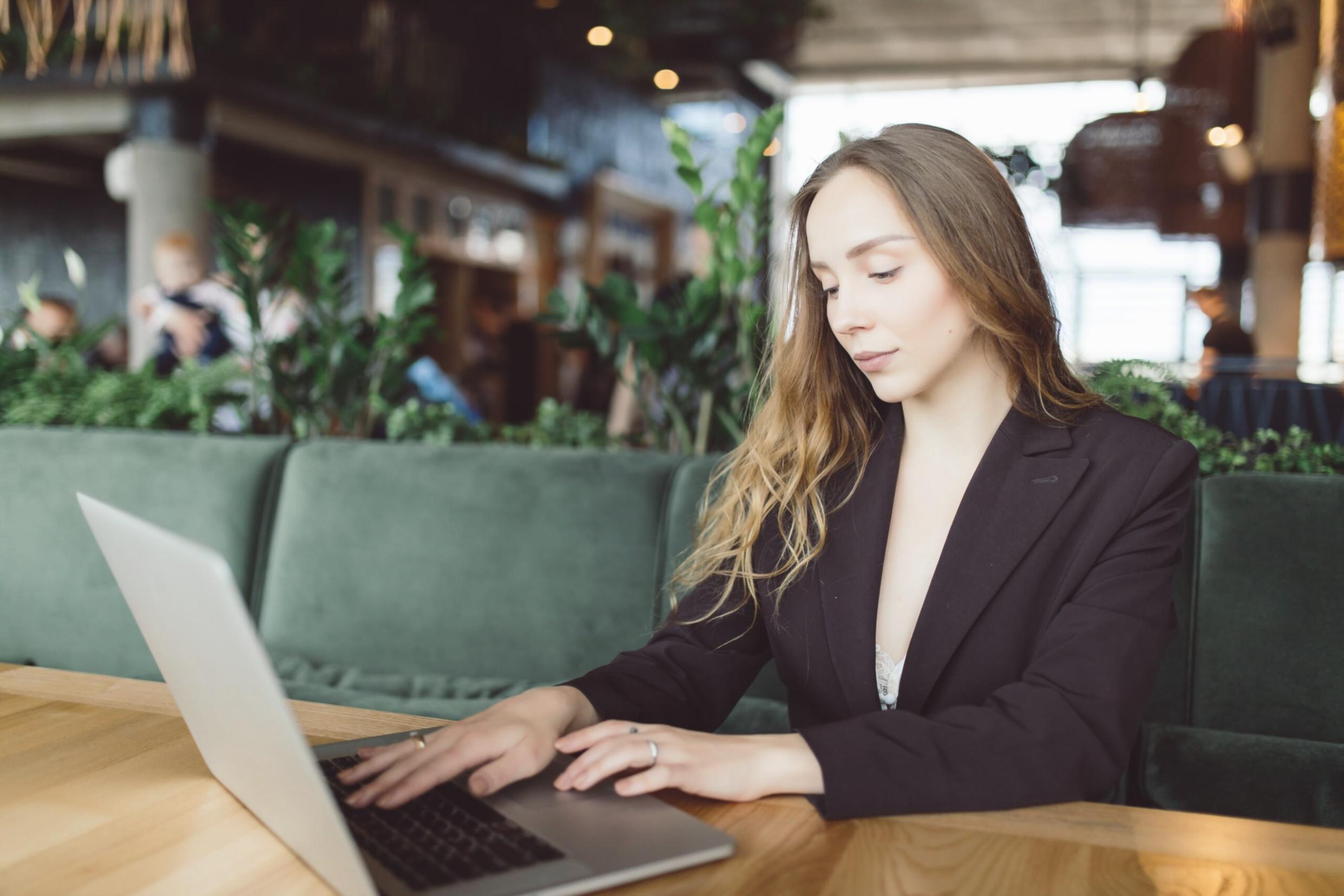 A person pausing to think at a desk before starting a new learning programme