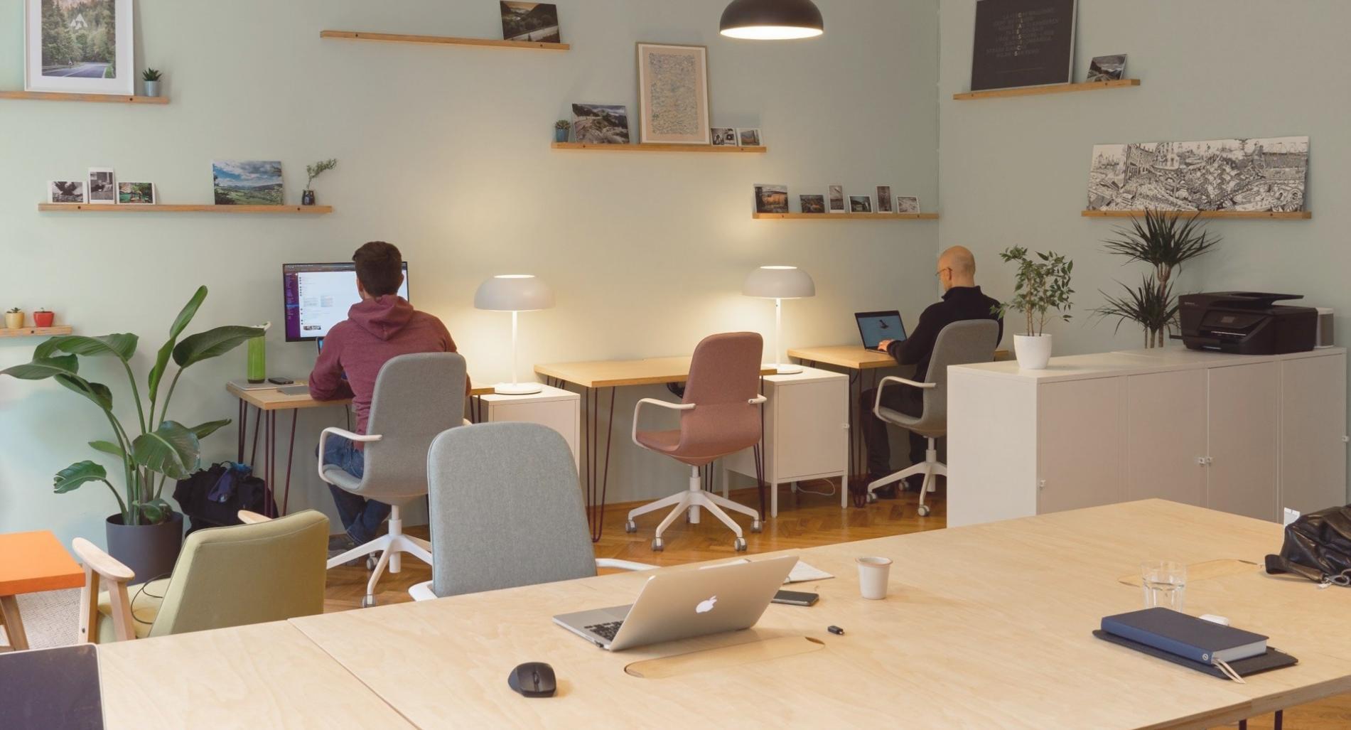 A facilitator guiding a small group through a practical assignment
